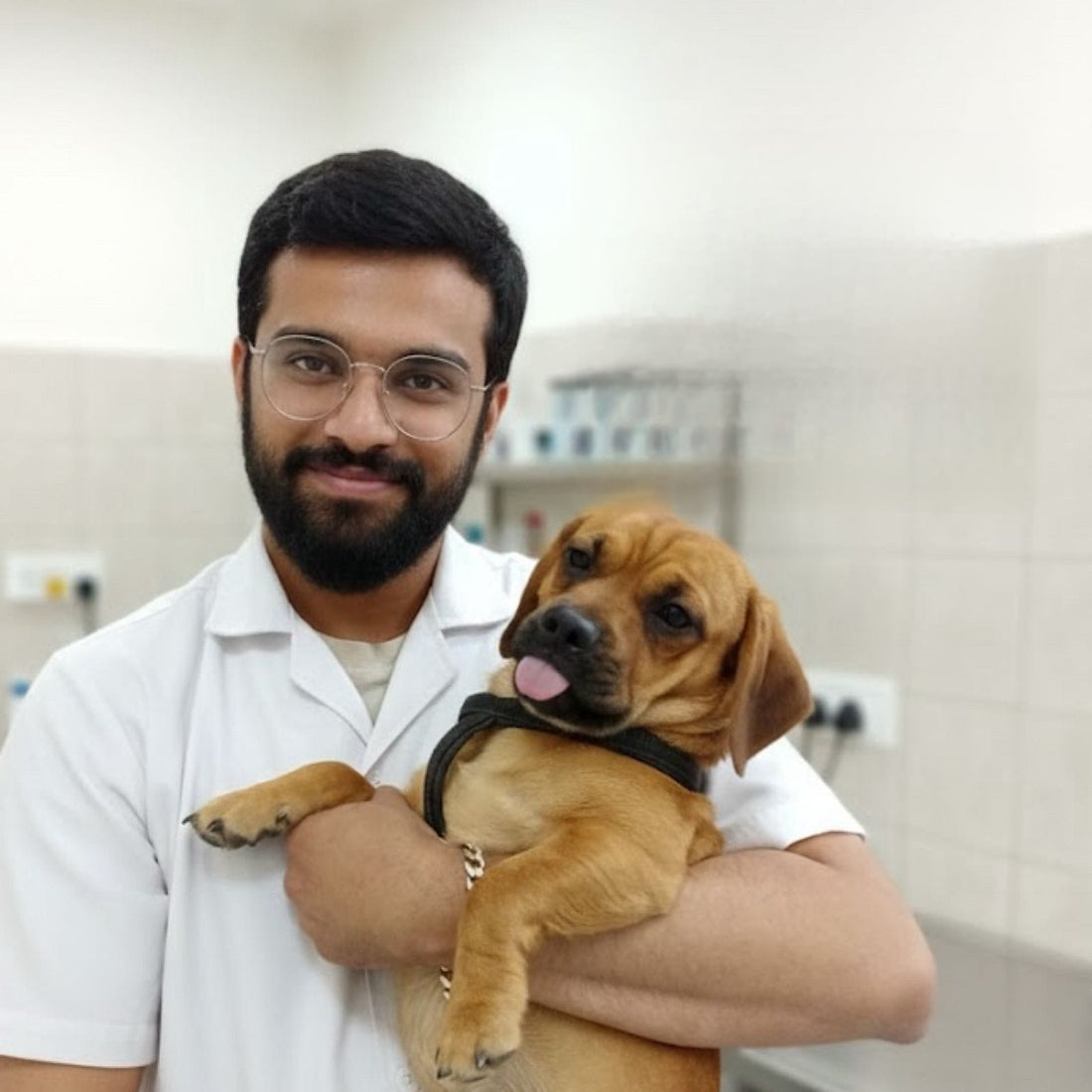 Dr. Samrat Shaw holding a dog in his clinic